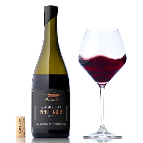 A glass and bottle of 2021 Carolyn's Block Pinot Noir, one of Westcott's 2021 Pinot Noirs available exclusively to wine club members.