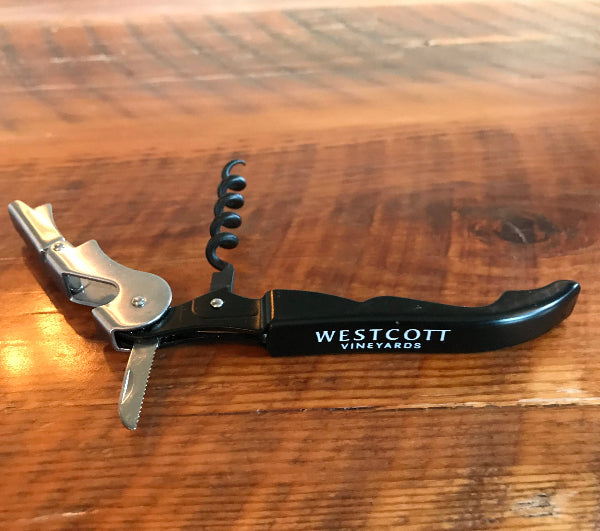 A black corkscrew with the words Westcott Vineyards etched in white on its side.