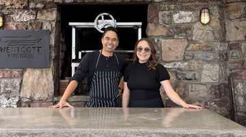 Chef Lester Hornilla and his partner Annie in front of the outdoor, wood-fired oven on the Westcott Vineyard's Niagara patio.