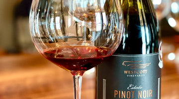 A bottle and glass of Westcott Vineyards 2019 Pinot Noir