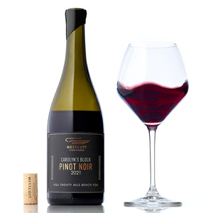 A glass and bottle of 2021 Carolyn's Block Pinot Noir, one of Westcott's 2021 Pinot Noirs available exclusively to wine club members. 