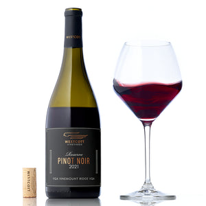 A bottle and glass of Westcott Vineyards' 2021 Reserve Pinot Noir.