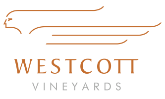 The Westcott Vineyards' burnt orange and white Logo.