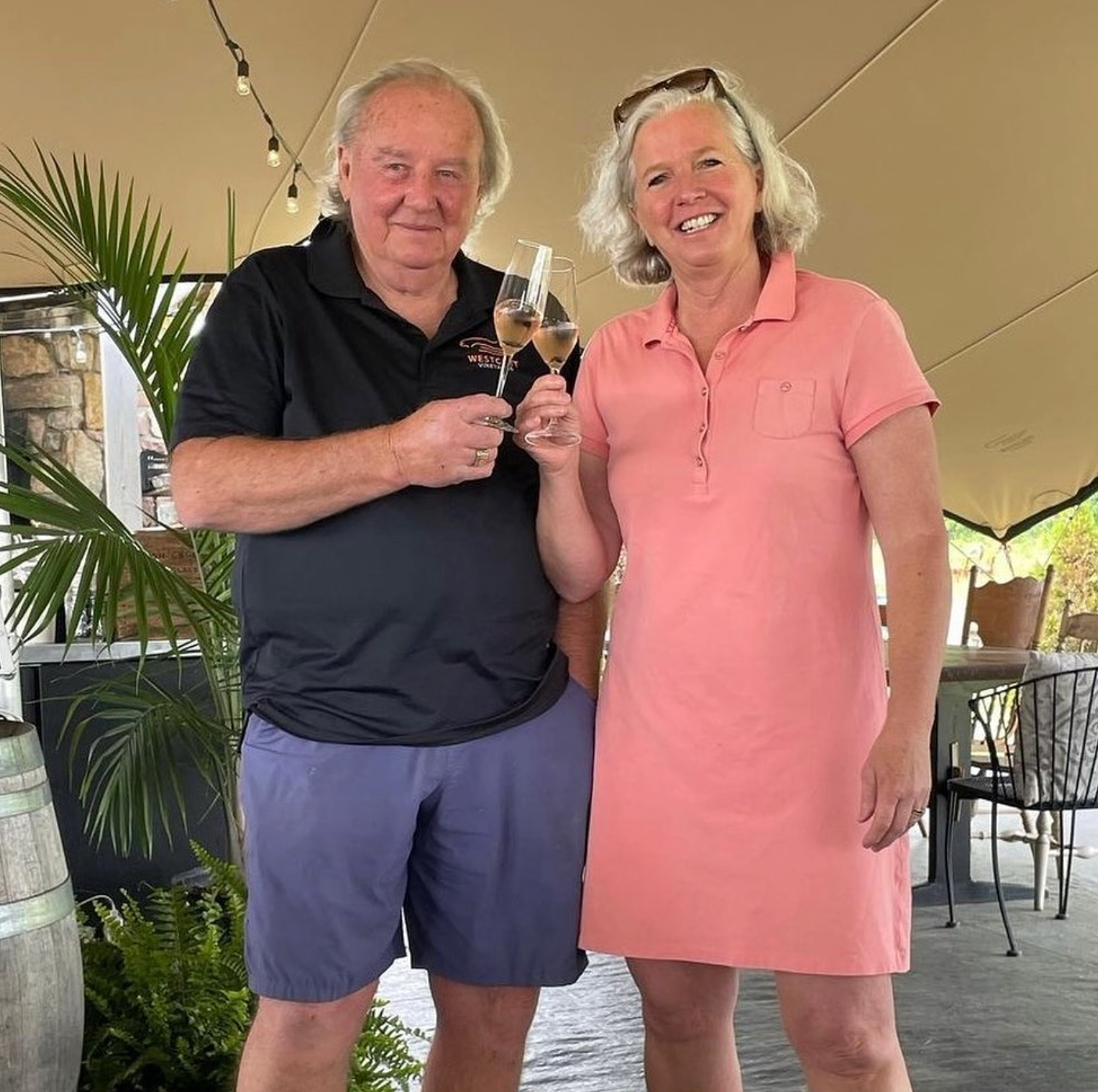 Co-owners Grant Westcott and Carolyn toast glasses of Westcott Vineyards' Brilliant Sparkling Rosé.