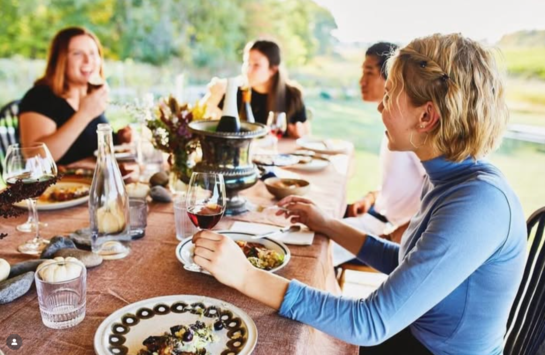 Premium wine club members enjoy exclusive dinner on the patio.