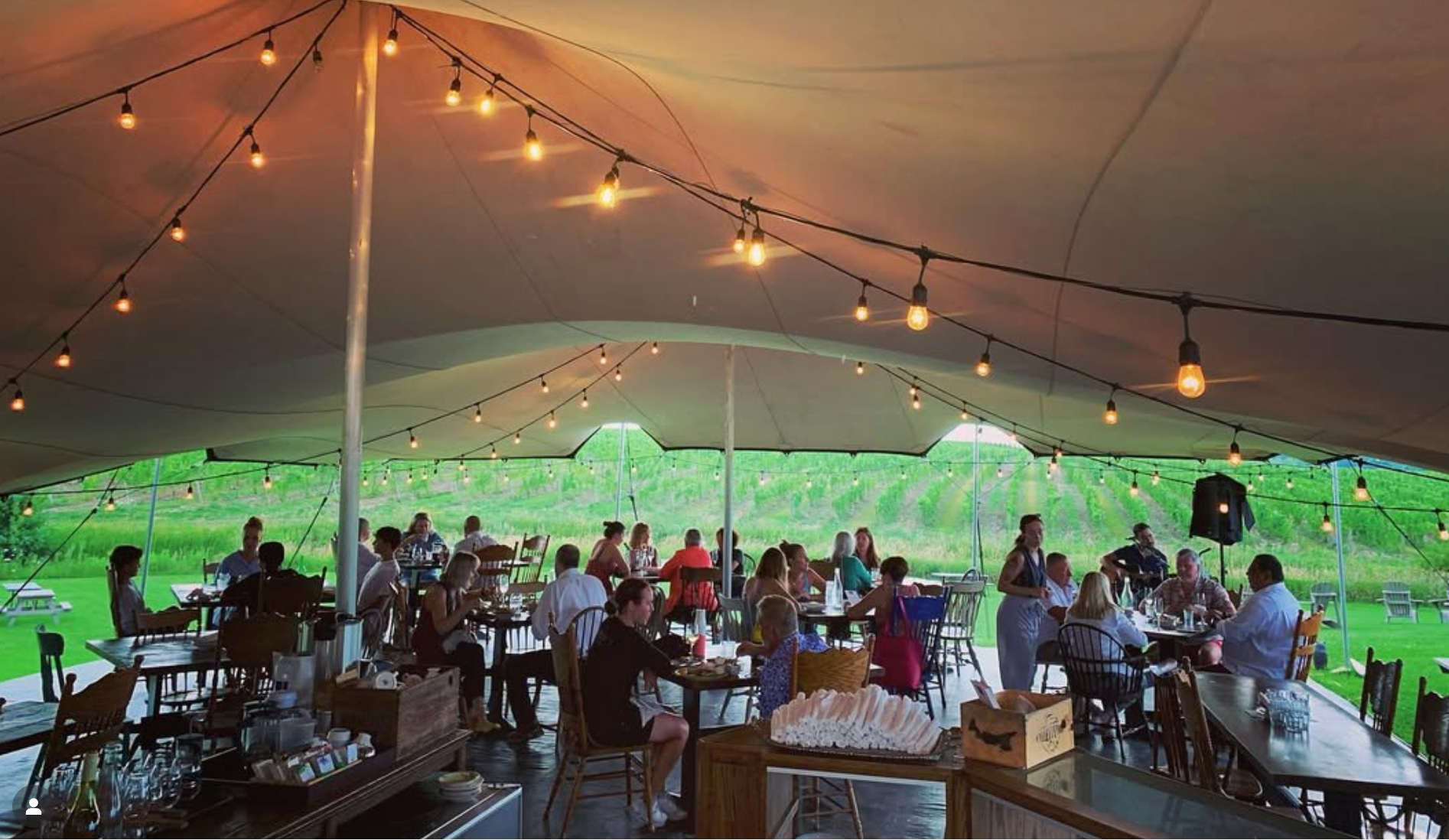 Westcott wine club members dining under the patio's Bedouin tent at a members-only exclusive event. 