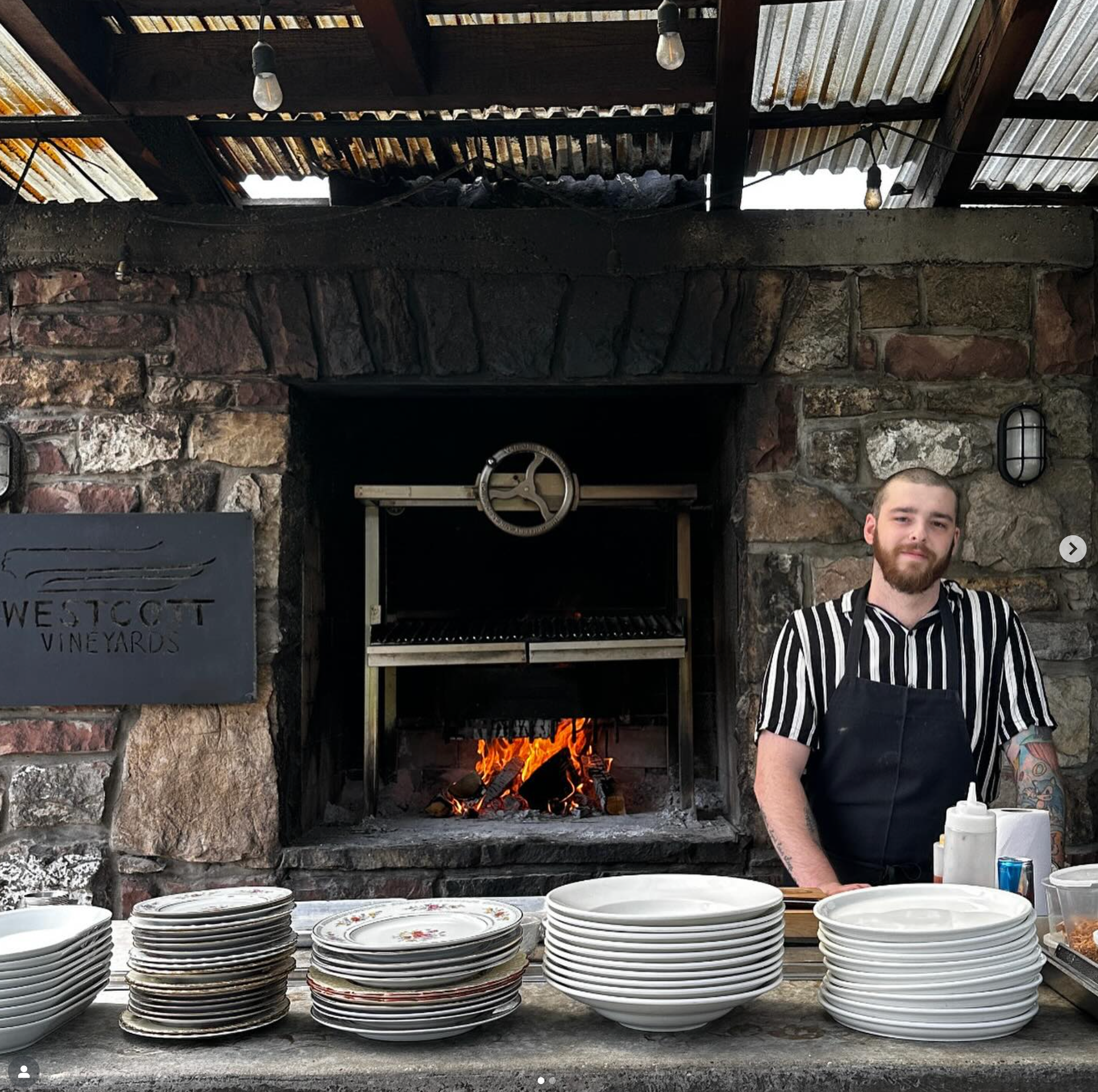 Chef McLeod stands in front of the Westcott Vineyards' patio wood-fired oven for a pop-up event. 